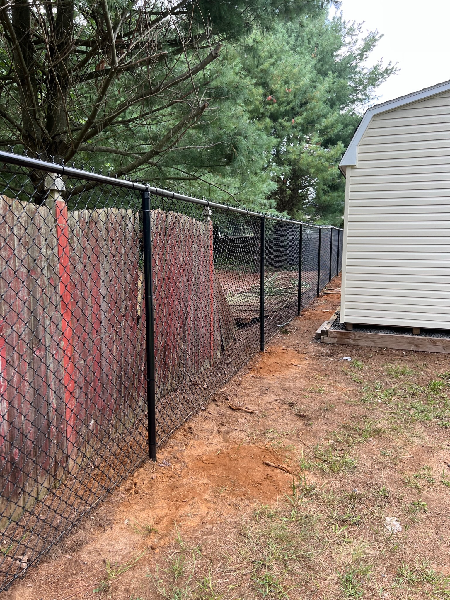 Long black chain link fence line