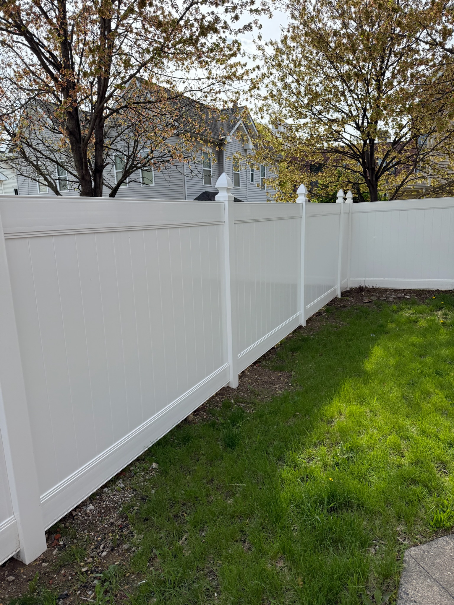 Tan vinyl picket fence